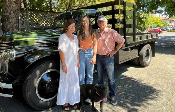 Bell Family poses in front of vintage farm truck - MALT