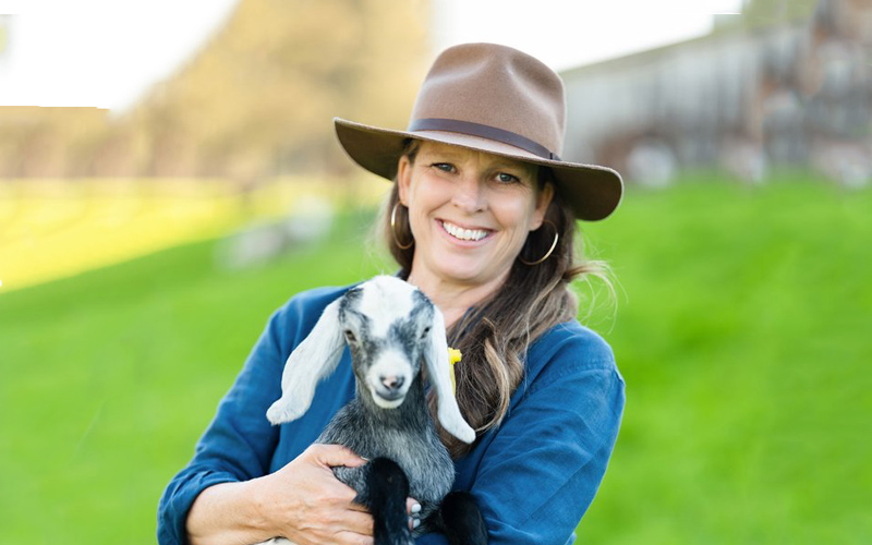 Tamara Hicks with a baby goat.
