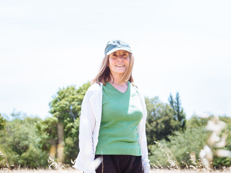 Linda Blackwood stands in a field