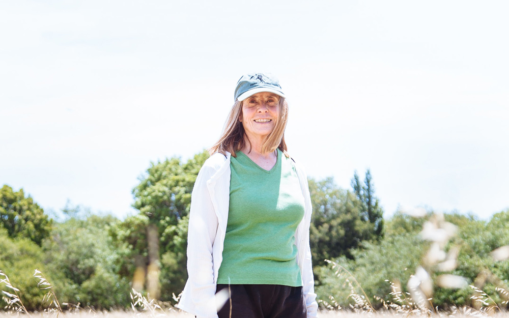 Linda Blackwood stands in a field